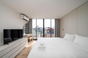 En eller flere senge i et værelse på Bach Plateaus Hotel