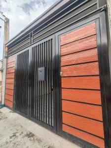 een paar garagedeuren op een gebouw bij Townhouse in Malolos - Ezzy Good Spot in Malolos