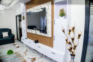 TV a/nebo společenská místnost v ubytování Résidence CAKFS + 2 fotografie