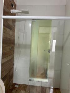 a glass shower in a bathroom with a toilet at Casa Barra Velha in Ilhabela