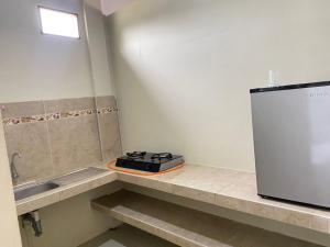 a kitchen with a stove on a counter next to a sink at BOCARENA in Bocapán