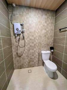 a bathroom with a toilet and a shower at Silver Sky hotel in Kuala Lumpur +11 photos