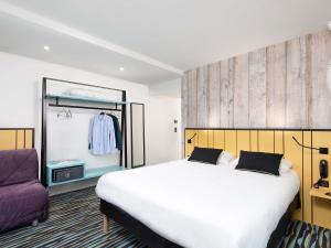 Postel nebo postele na pokoji v ubytování ibis Styles Macon Centre