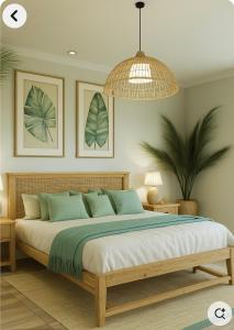 a bedroom with a large bed with green pillows at Aulea Siargao in General Luna