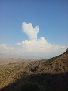 a view of a mountain with a blue sky at فندق الابتسامة  +1 photo