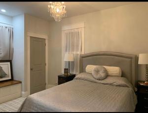 a bedroom with a bed with a pillow on it at 4 bedroom home- historic-downtown jax- min to UF health and everbank stadium in Jacksonville