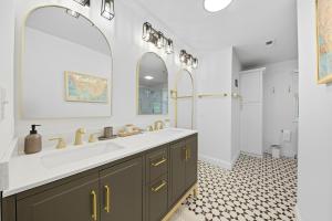 a bathroom with a sink and a mirror at Bedrooms with Private Bath - 12min from Uptown in Charlotte +9 photos