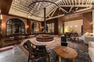 a living room with a couch and a table at The Woven Inn in Shunde