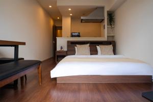 Ένα ή περισσότερα κρεβάτια σε δωμάτιο στο Poka Premium Kuramae 暖宿蔵前