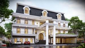 a large white building with a black roof at Swiss-Belexpress Palu in Palu