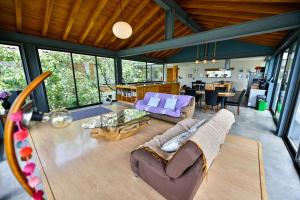 a living room with a couch and a table at Utopia Casas Boutique in Oaxaca City
