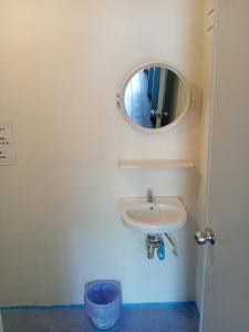 a bathroom with a sink and a mirror at Lakchai Resort in Ko Chang