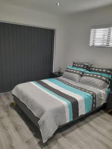 En eller flere senge i et værelse på Suite Serenity