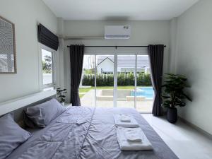 Postel nebo postele na pokoji v ubytování Serene Wynn Villa Sansai + 61 fotografií