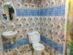 a bathroom with a toilet and a sink at Silver Sky hotel in Kuala Lumpur