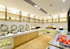 a large kitchen with a lot of counter tops at City Comfort Inn Hantianhe Airport Hengdian Street in Wuhan