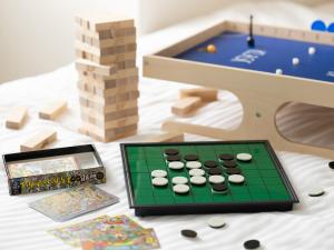 a table with a chess board and a game at Brackets Hotel Osaka Hommachi in Osaka
