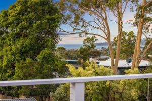 a view from the balcony of a house with trees at Luxe Oceanview - Bay Views Beach & Wineries in Dromana