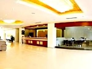 a large room with people sitting at tables in a building at Yue Lai Yue Hotel in Guangzhou