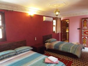 Letto o letti in una camera di Dar El Mathaf