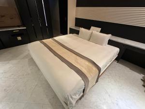 Voodi või voodid majutusasutuse Hotel Rima chocolat toas