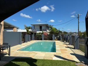 a swimming pool on top of a house at Shady Rest Motel in Gympie