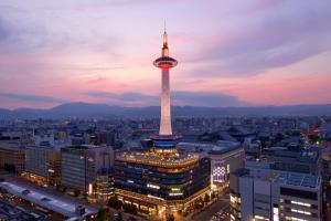 a view of a city with a tower at night at Kyoto Tower Hotel in Kyoto +46 photos