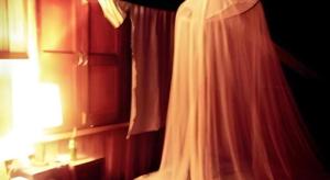 a bedroom with a white curtain and a window at Baan ChanKhiang at ChiangKhan in Chiang Khan +183 photos