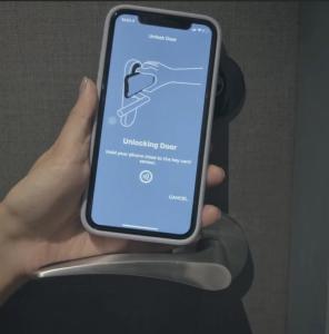 a person holding a cell phone in their hand at Heritage Collection on Seah - Mobile App Check-In in Singapore