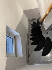 a staircase in a house with a mirror at Ecolodge 1 Mini Apartment in Niederdorla +1 photo