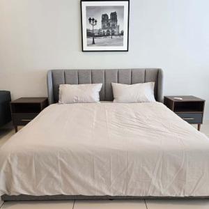 a bedroom with a bed with two night stands at 3 Tower Ampang Suite in Kuala Lumpur +13 photos