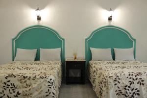 Letto o letti in una camera di Posada Ya´ax Ich