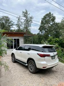 a white car parked in front of a house at Villa Krabi Center in Ban Nong Chaeng