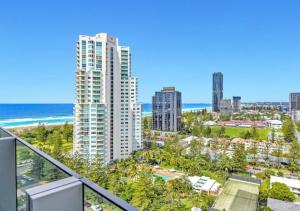 a balcony with a view of a city and the ocean at Luxury 2BR 16th Flr Ocean Views in Gold Coast