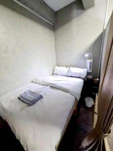 En eller flere senge i et værelse på Nonoteru Chiang Mai , KamPhaengDin