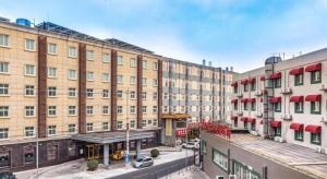 an overhead view of a city street with buildings at Qiuguo Hotel Beijing BIEC & Airport in Beijing