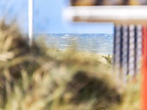 a blurry view of the ocean from a window at 8 person holiday home in Hjørring-By Traum in Kærsgård Strand