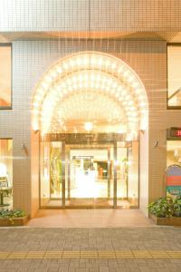 an entrance to a building with an archway at Kochi Sunrise Hotel in Kochi