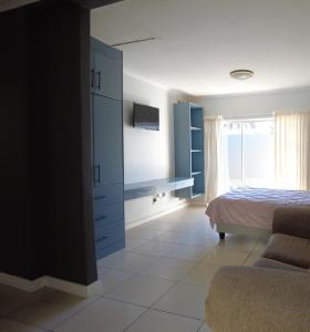 En eller flere senge i et værelse på Studio Flat Bayside