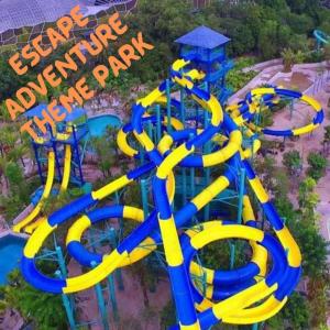 an aerial view of a water park with a water slide at GEORGETOWN @ NEW WAVE HOTEL in George Town