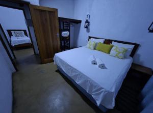 a bedroom with a large bed with white sheets at Kigeni Safari Lodge & Spa in Vaalwater