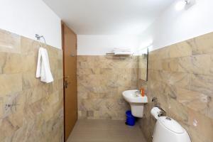 a bathroom with a sink and a toilet at Altinho Heritage Castle Homestay in Ettumānūr +64 photos