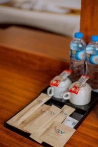 a table with two bottles of water and some paper towels at Vilayvong Hotel in Vang Vieng