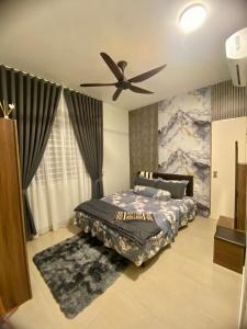a bedroom with a bed and a ceiling fan at EJ HomeStay Sireh Residence Apartment in Kota Bharu +8 photos