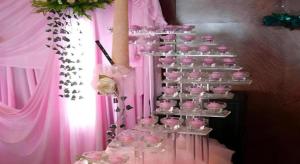 a bunch of pink cupcakes on a shelf at Qingdao Donghai Hotel in Qingdao