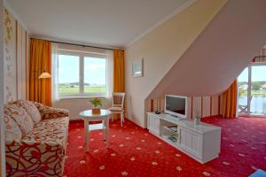 TV a/nebo společenská místnost v ubytování Hotel Godewind