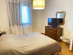 TV a/nebo společenská místnost v ubytování Ohana