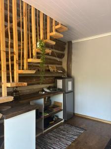 a room with wooden stairs with a plant on the wall at Villa Keys in Wilderness
