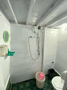 a bathroom with a shower and a toilet at Wonder By Celebbest in Komodo Labuan Bajo Airport