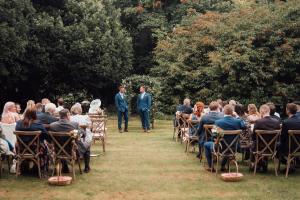 a couple walking down the aisle at a wedding ceremony at Georgian Villa Corporate and Weddings in Ross on Wye